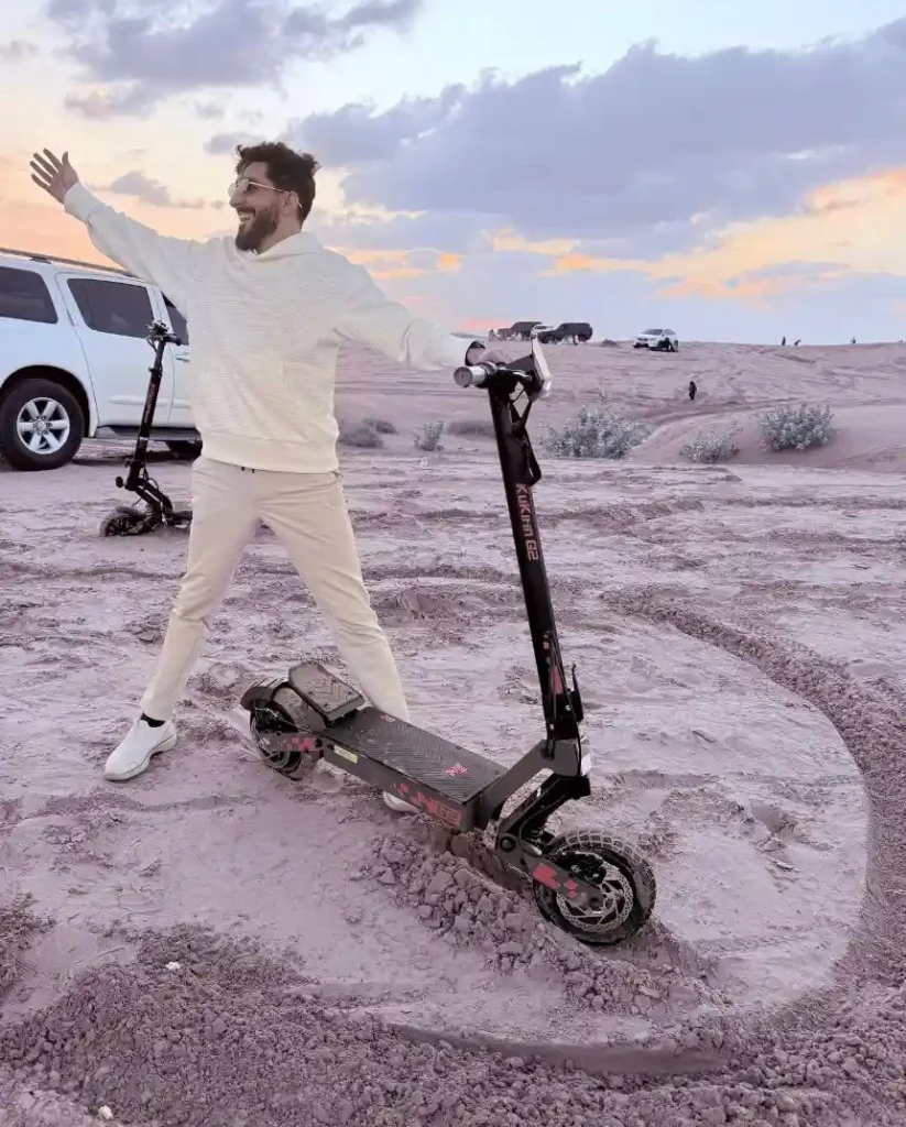 UAE's #1 E-Scooter Store: Al Mubdie Scooters 2 manager of al mubdie scooters in desert with a scooter